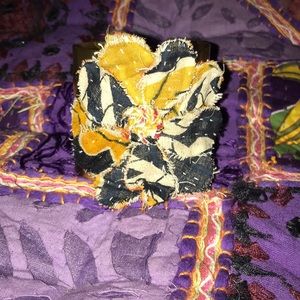 gold arm cuff with fabric flower detail